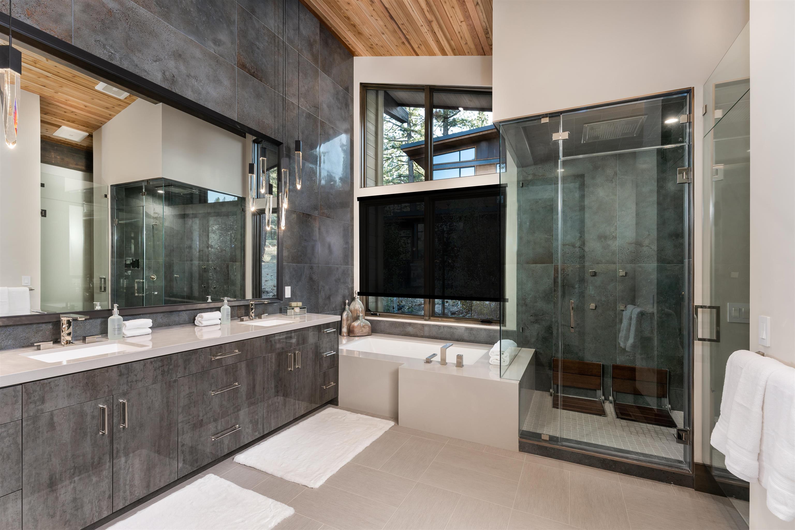13150 Snowshoe Thompson Circle Truckee, CA 96161 - Photo 10 of 21 a bathroom with a sink mirror and shower