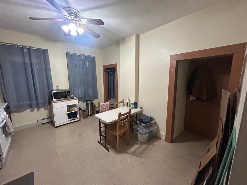122 A Spring Street, Unit 3 Cambridge, MA 02141 - Photo 3 of 11 a living room with furniture and a flat screen tv