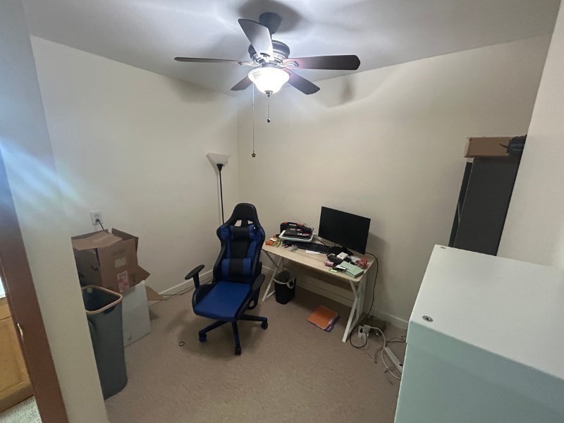 122 A Spring Street, Unit 3 Cambridge, MA 02141 - Photo 9 of 11 a view of a workspace with furniture and a window