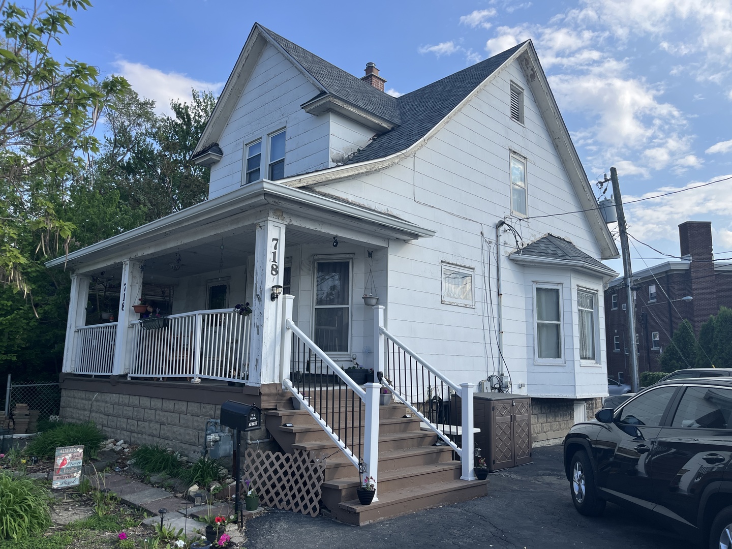 718 Plainfield Road Joliet, IL 60435 - Photo 2 of 28 a view of a house with wooden walls and stairs
