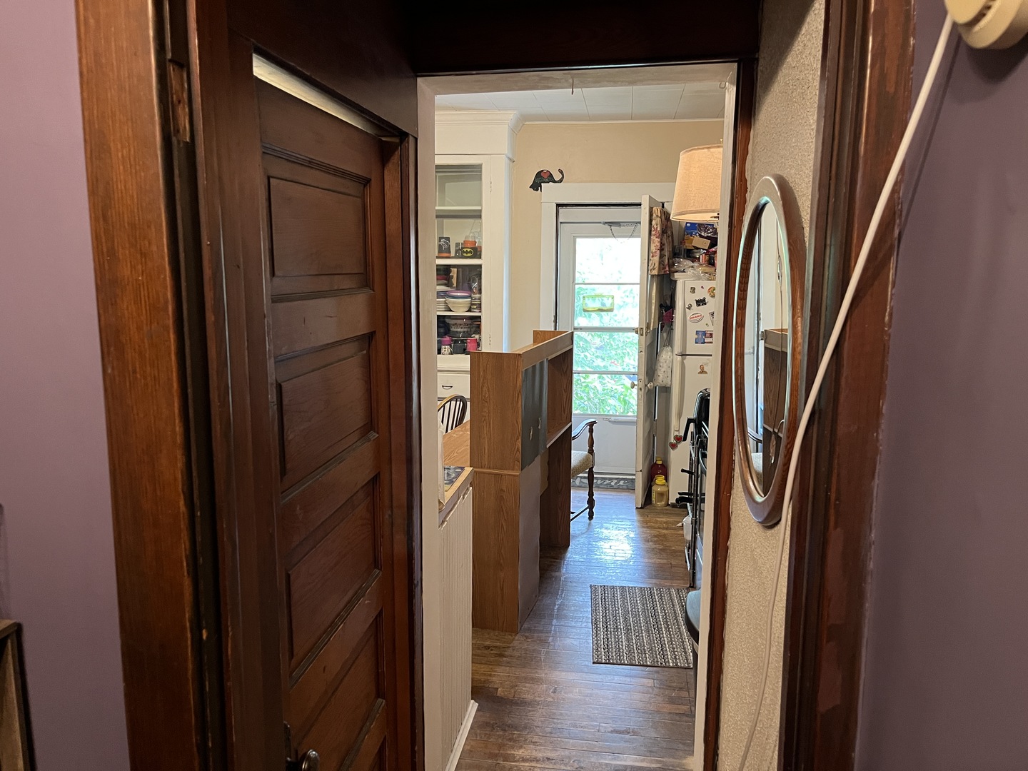 718 Plainfield Road Joliet, IL 60435 - Photo 9 of 28 a view of a hallway with wooden floor and stairs