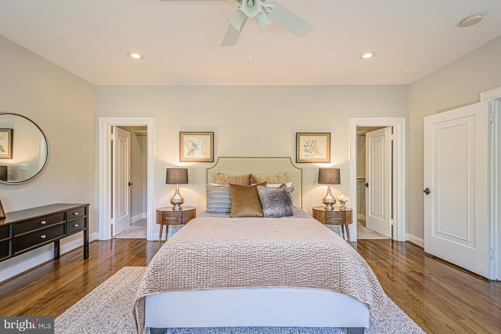 4331 Blagden Avenue Northwest Washington, DC 20011 - Photo 20 of 38 a bed room with two bed and a chandelier