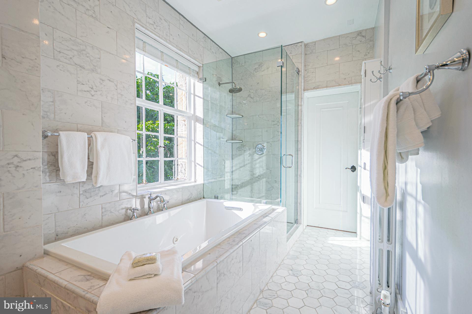 4331 Blagden Avenue Northwest Washington, DC 20011 - Photo 23 of 38 a bathroom with a tub sink and shower