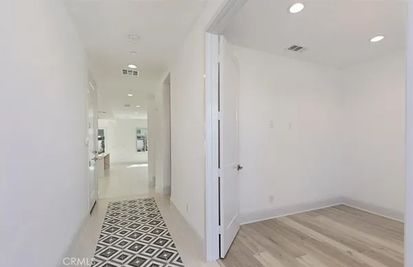 a large kitchen with stainless steel appliances kitchen island a large counter top and a stove