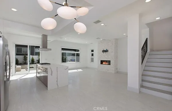 a kitchen with a stove and a refrigerator
