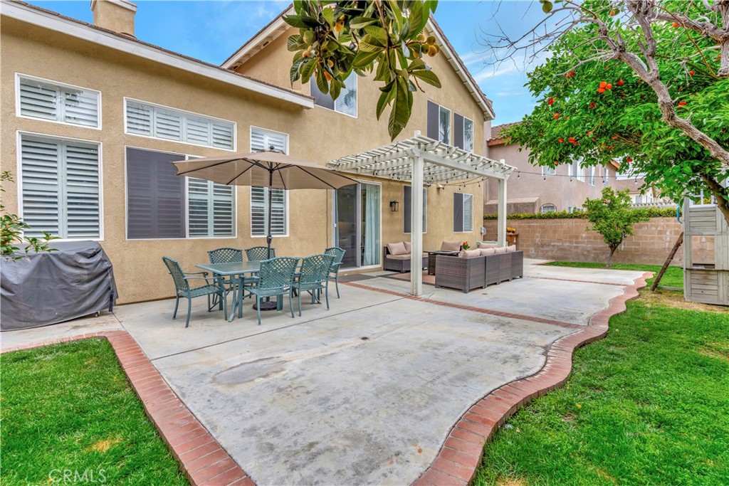 412 Mackena Place Placentia, CA 92870 - Photo 31 of 42 a view of a house with patio and a garden