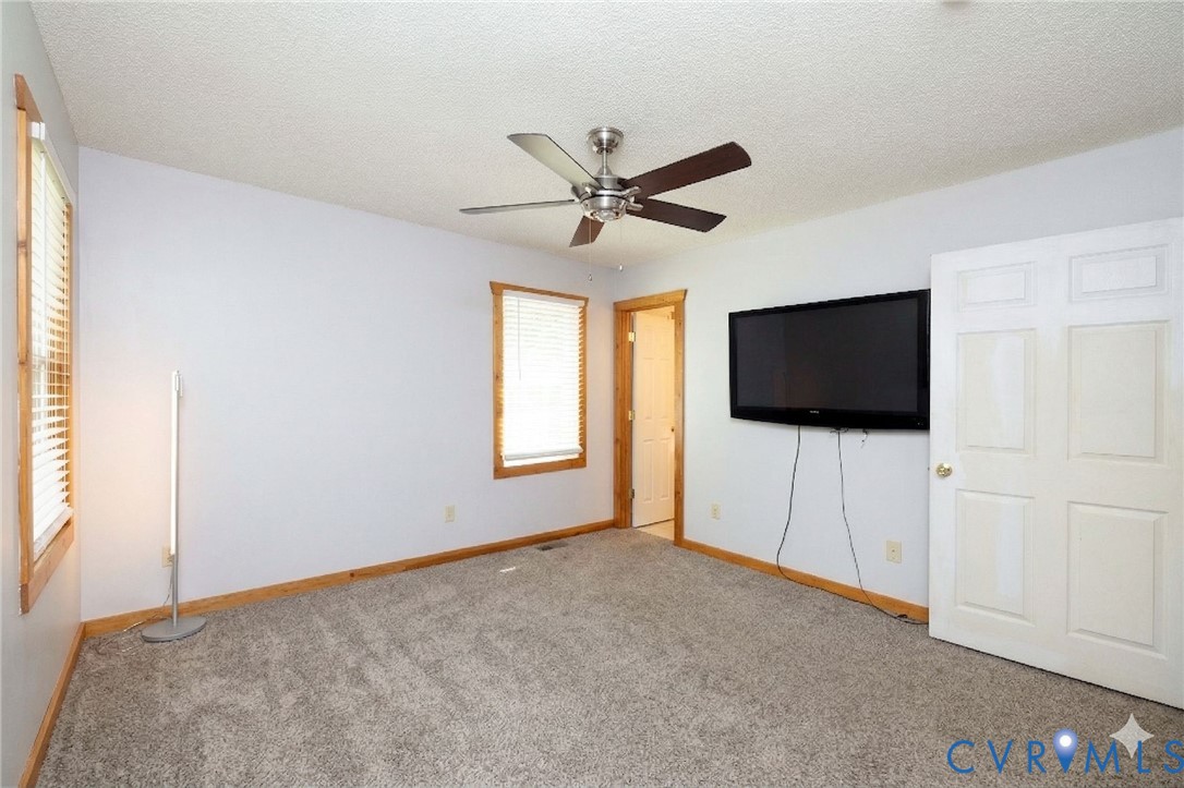 460 Horseshoe Road Jarratt, VA 23867 - Photo 10 of 24 a living room with flat screen tv and a window