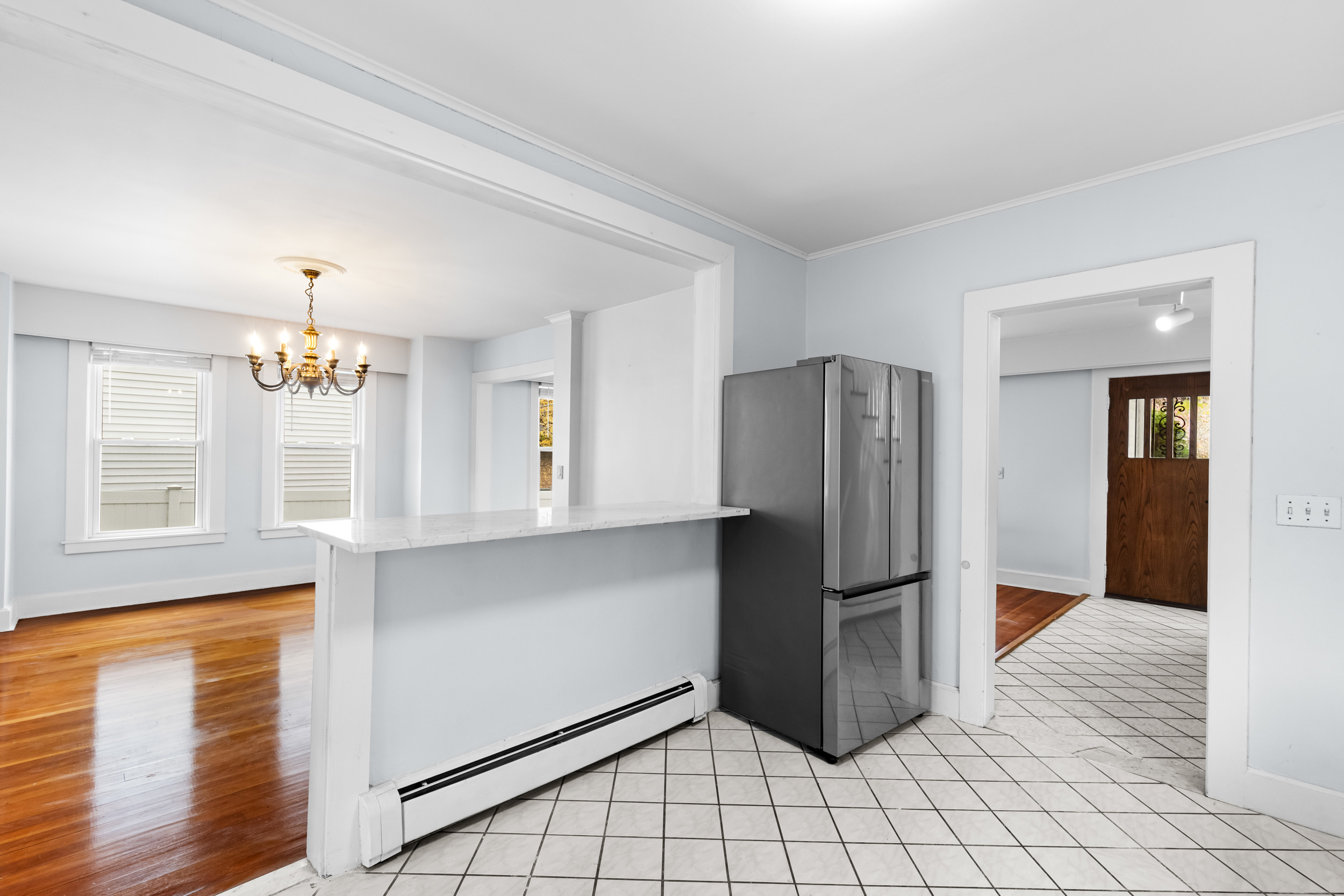 49 Valley Road Stamford, CT 06902 - Photo 11 of 37 a kitchen with stainless steel appliances a refrigerator and a stove top oven