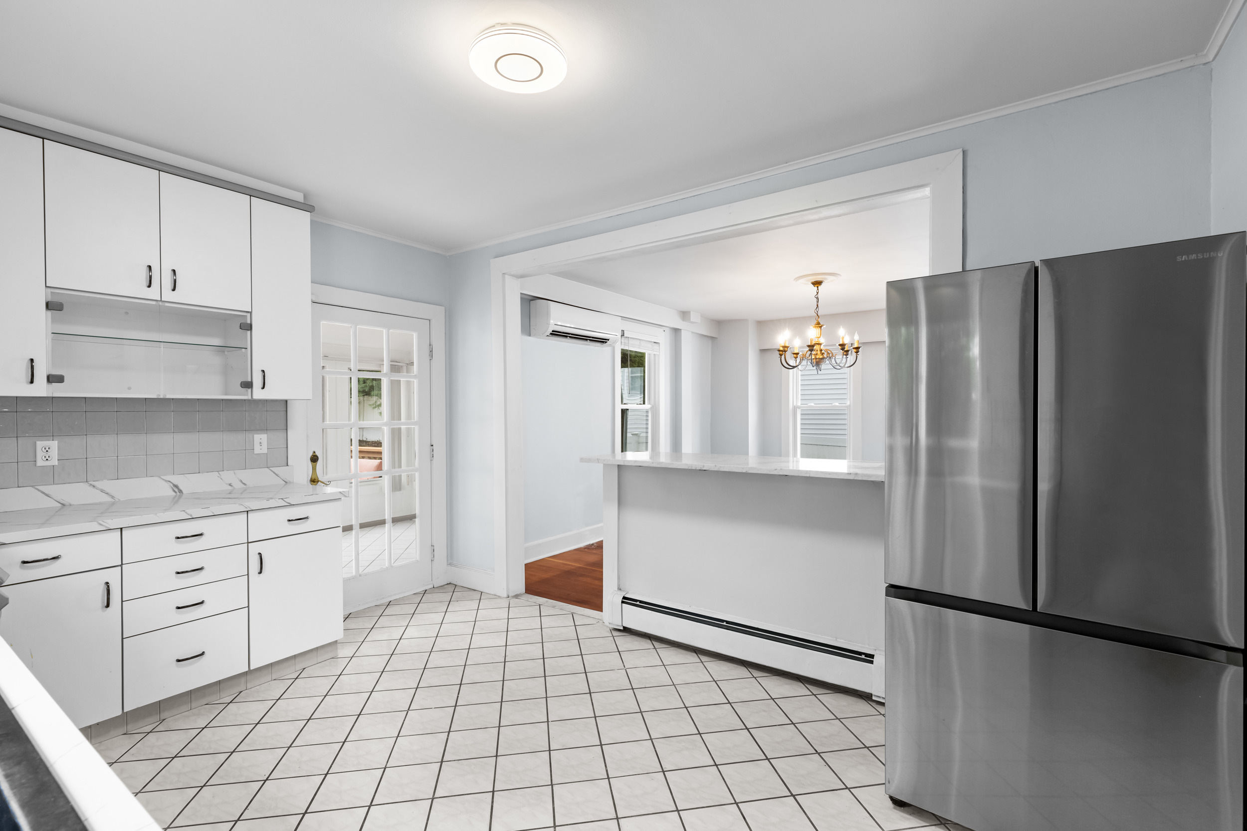 49 Valley Road Stamford, CT 06902 - Photo 12 of 37 a kitchen with white cabinets and refrigerator