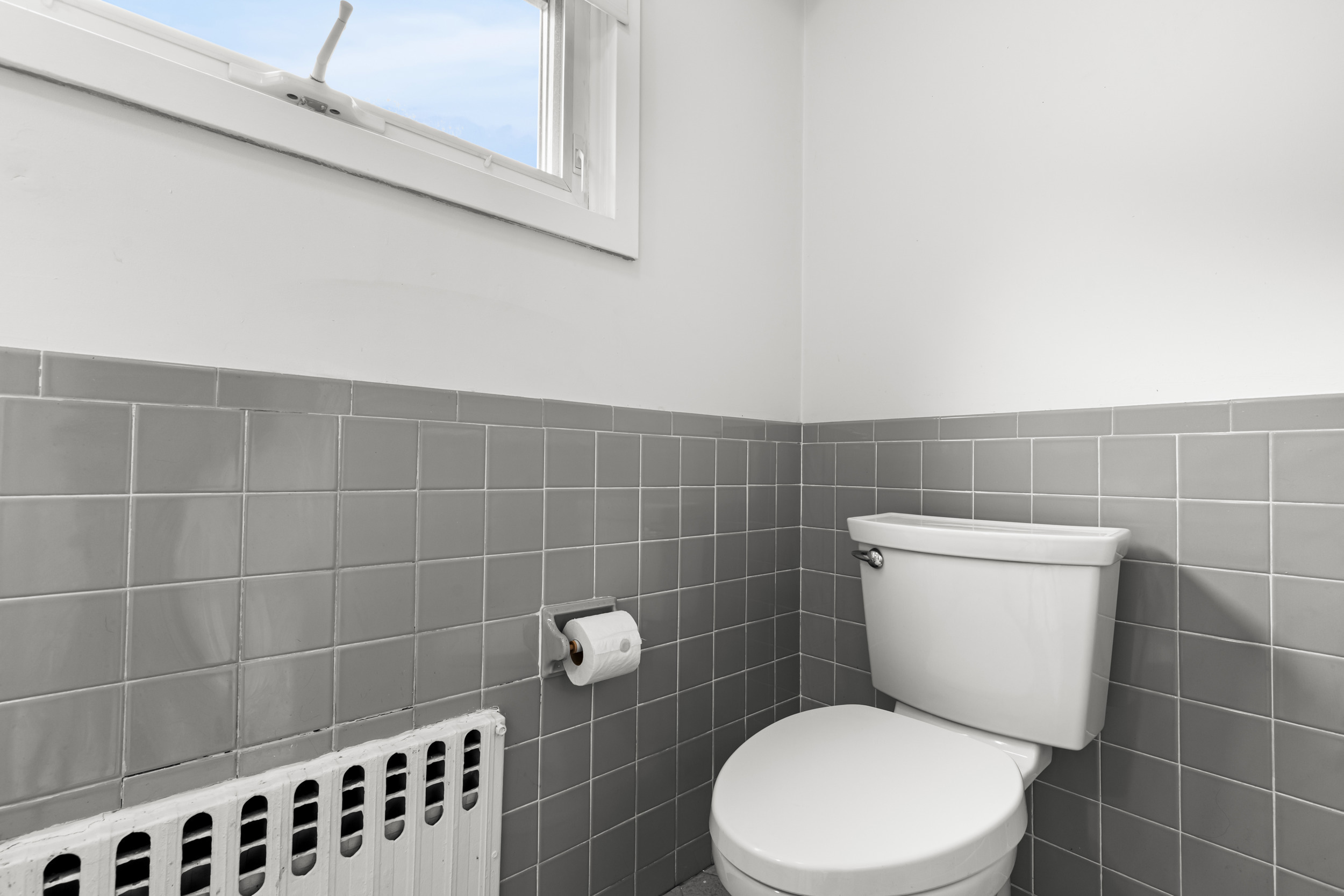 49 Valley Road Stamford, CT 06902 - Photo 16 of 37 a white toilet sitting next to a bathroom sink