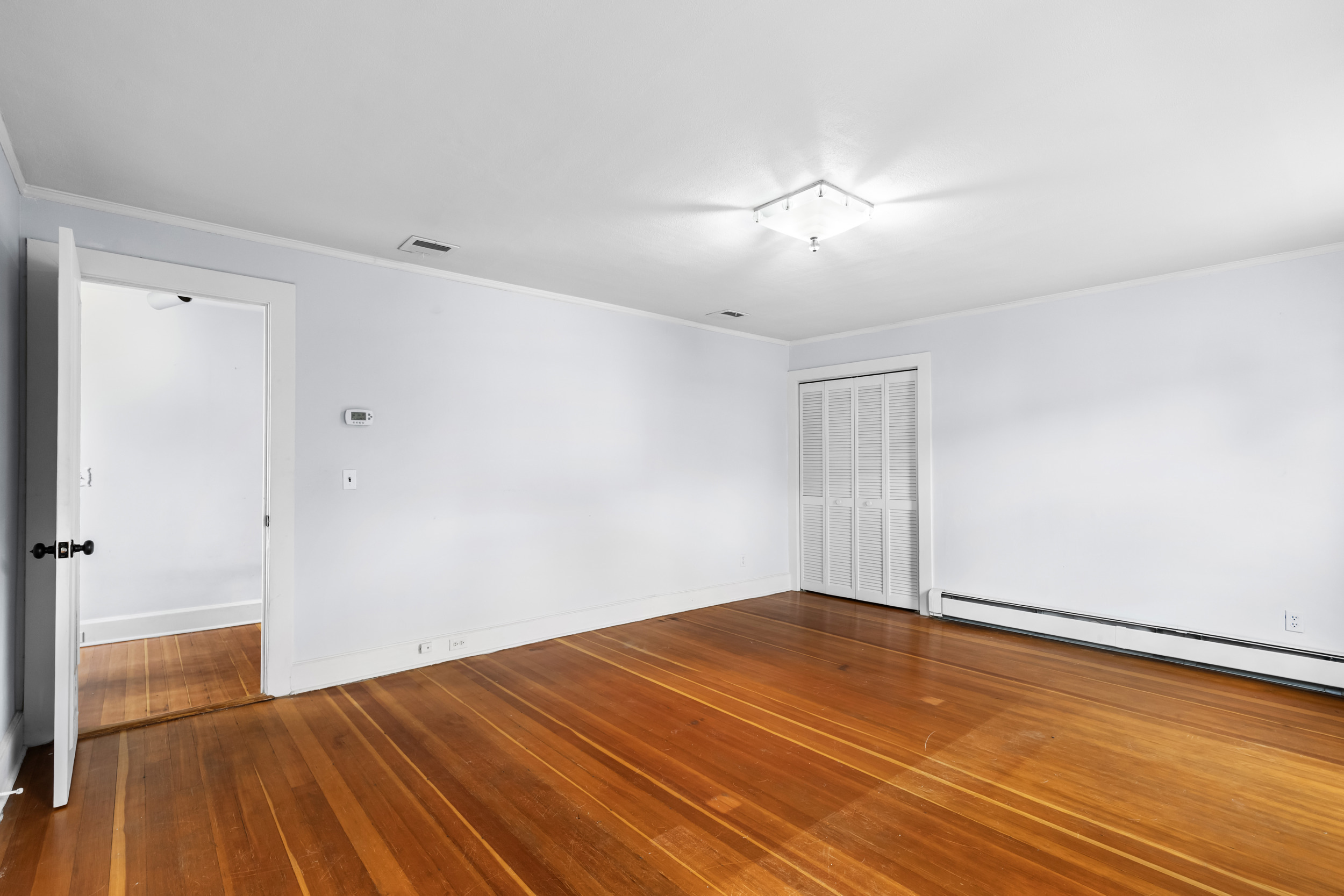 49 Valley Road Stamford, CT 06902 - Photo 18 of 37 a view of empty room with wooden floor
