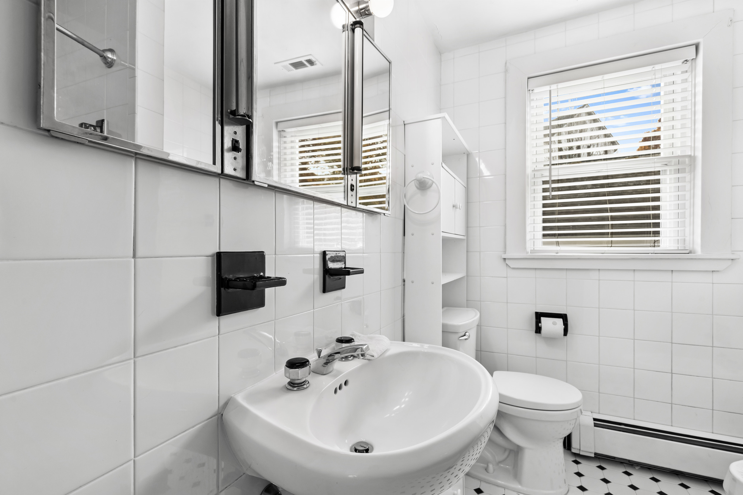 49 Valley Road Stamford, CT 06902 - Photo 21 of 37 a bathroom with a sink a toilet and mirror