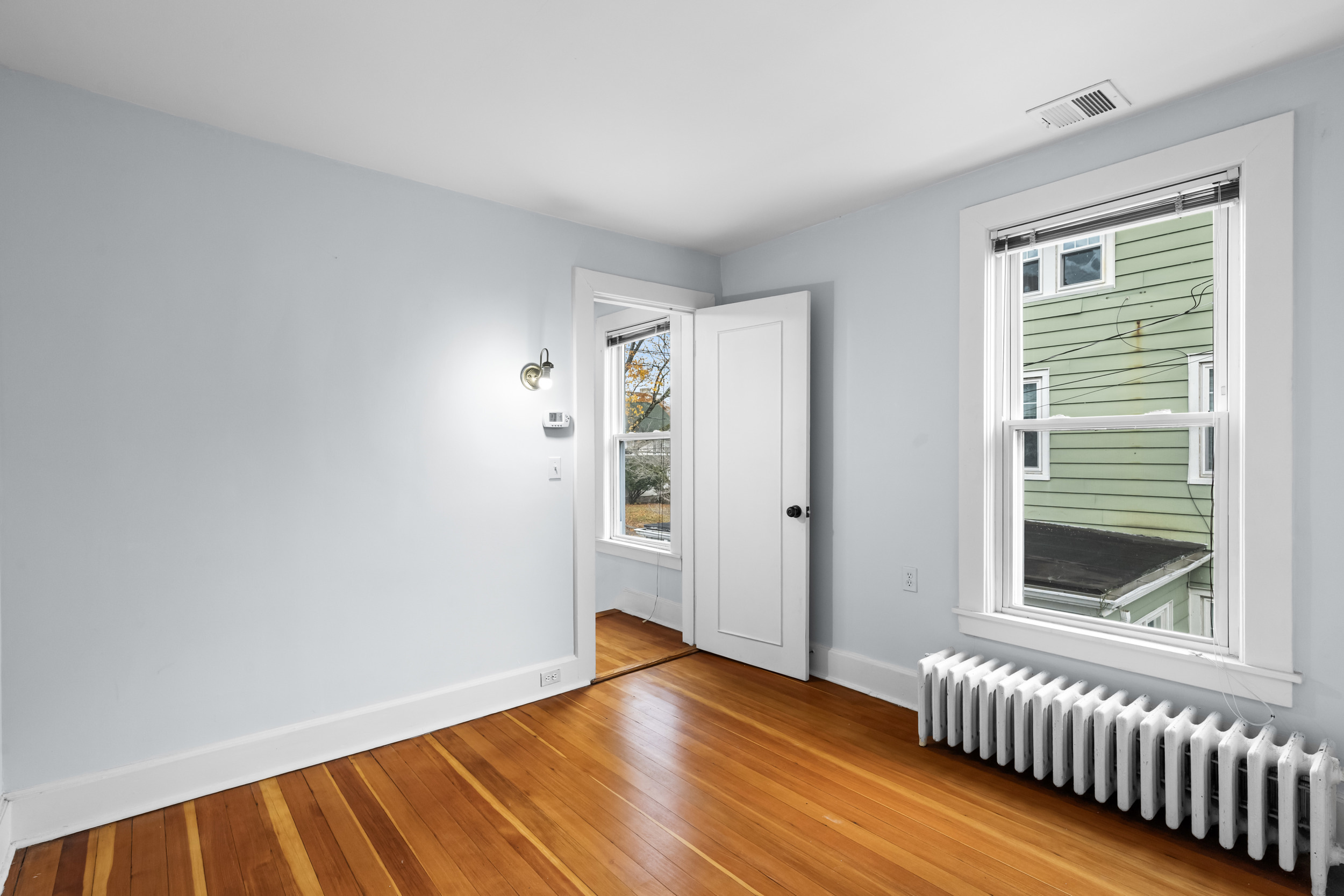 49 Valley Road Stamford, CT 06902 - Photo 24 of 37 a view of empty room with wooden floor and fan