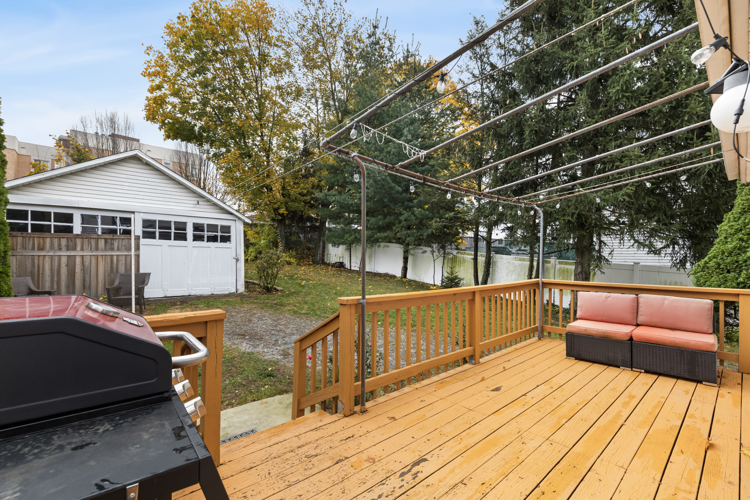 49 Valley Road Stamford, CT 06902 - Photo 29 of 37 a view of a roof deck with couches chairs and wooden floor