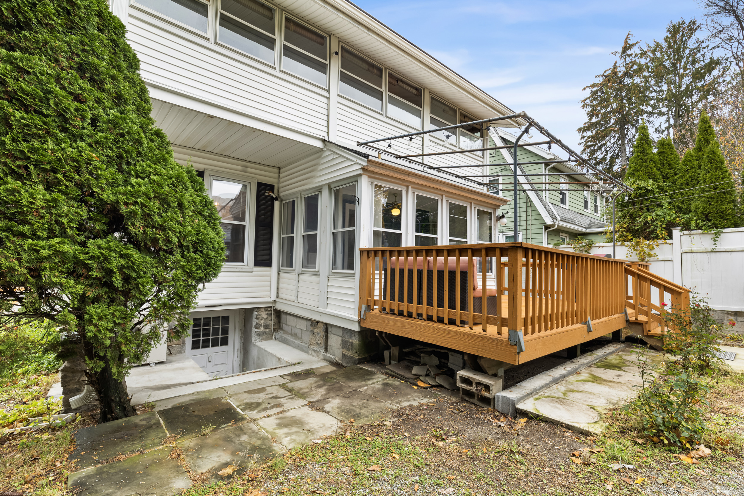 49 Valley Road Stamford, CT 06902 - Photo 30 of 37 a view of a house with a wooden deck
