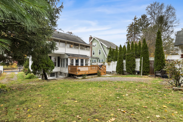 49 Valley Road Stamford, CT 06902 - Photo 33 of 37 a view of a house with a big yard and large trees