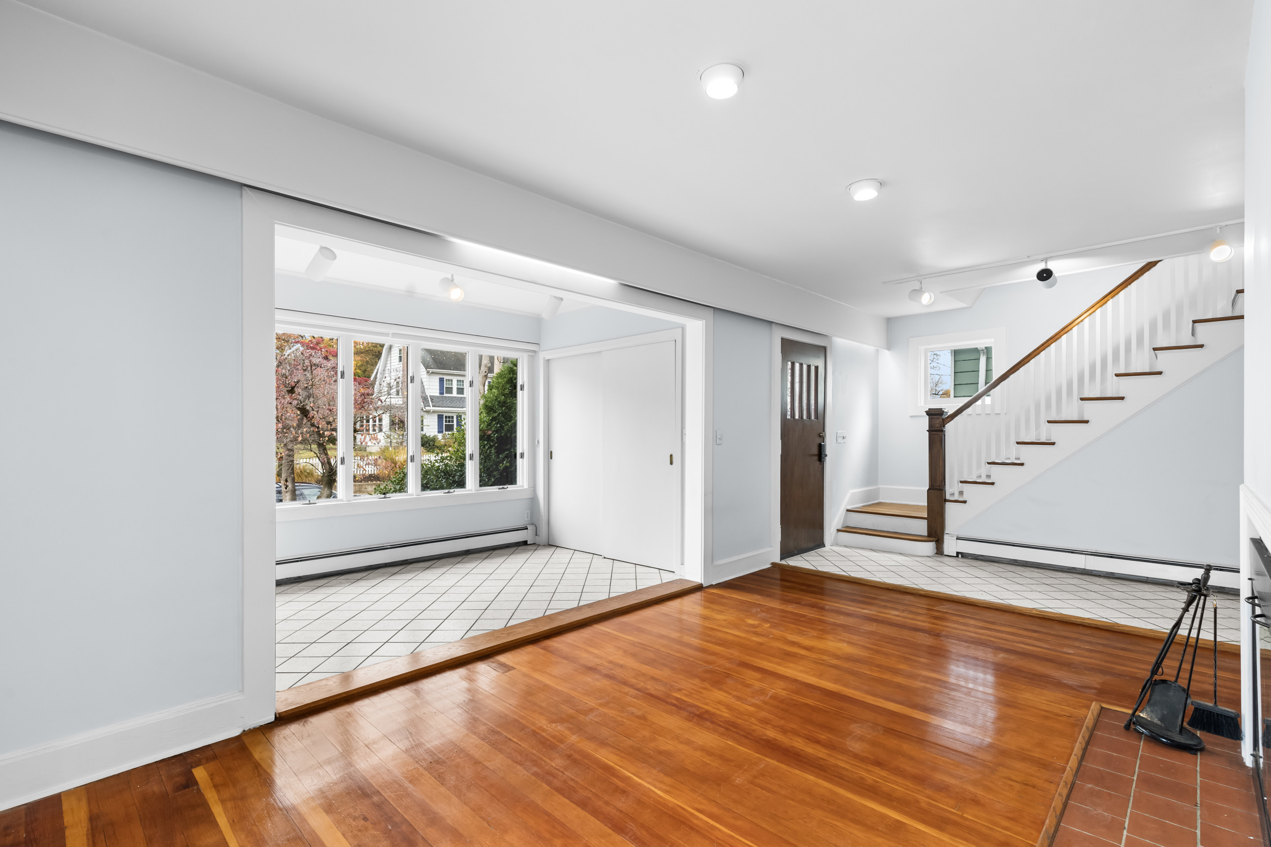 49 Valley Road Stamford, CT 06902 - Photo 6 of 37 a view of an empty room with wooden floor and a window