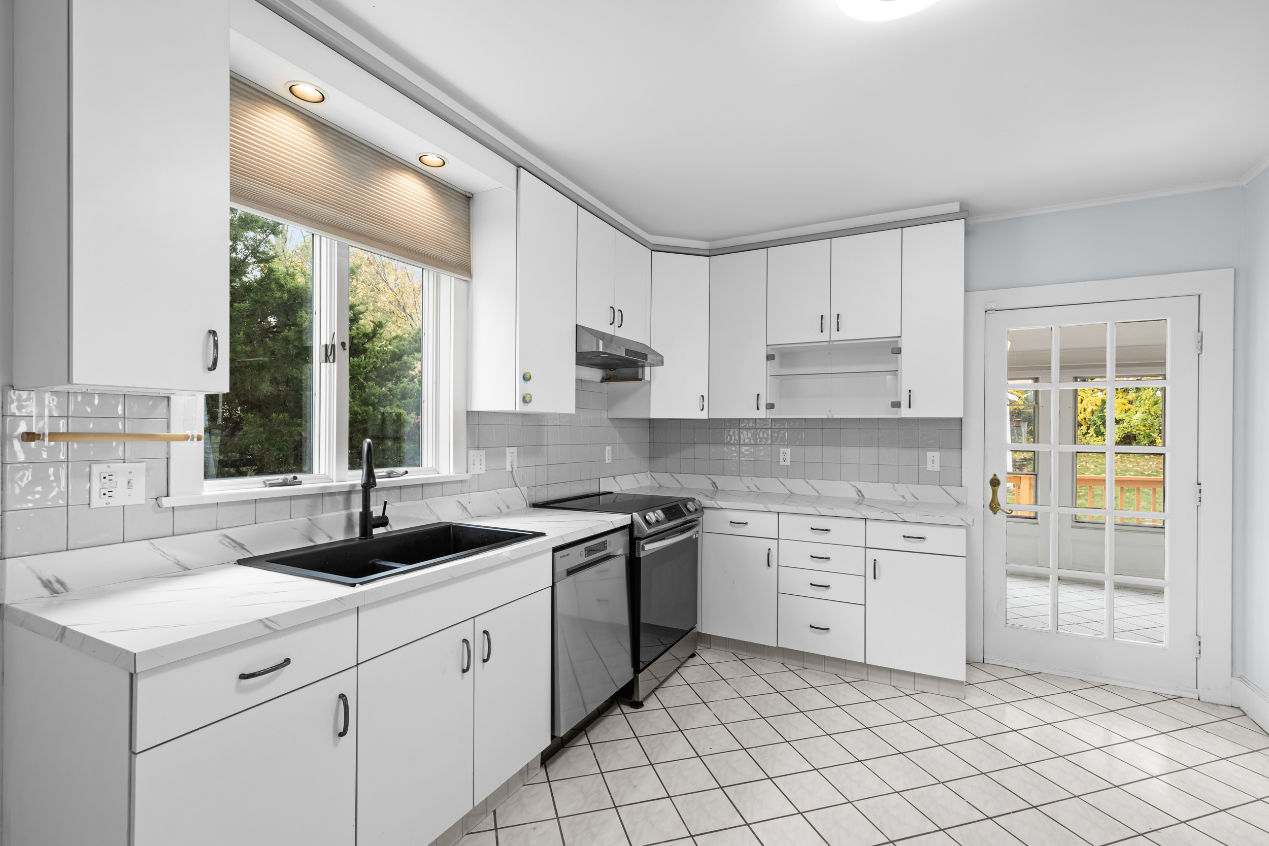 49 Valley Road Stamford, CT 06902 - Photo 9 of 37 a kitchen that has a sink and a stove in it