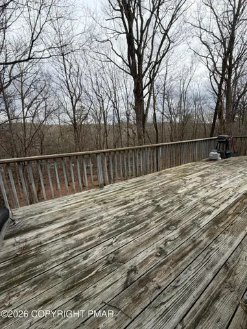 a view of swimming pool with trees in the background
