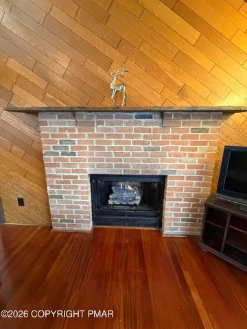 a fireplace with wooden floor