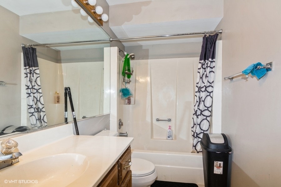 19265 Lange Street Lansing, IL 60438 - Photo 12 of 18 a bathroom with a sink and a mirror