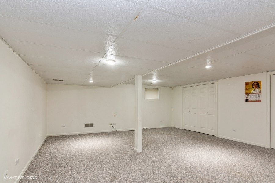 19265 Lange Street Lansing, IL 60438 - Photo 13 of 18 an empty room with a empty space and windows