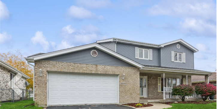 19265 Lange Street Lansing, IL 60438 - Photo 2 of 18 a front view of a house with garden