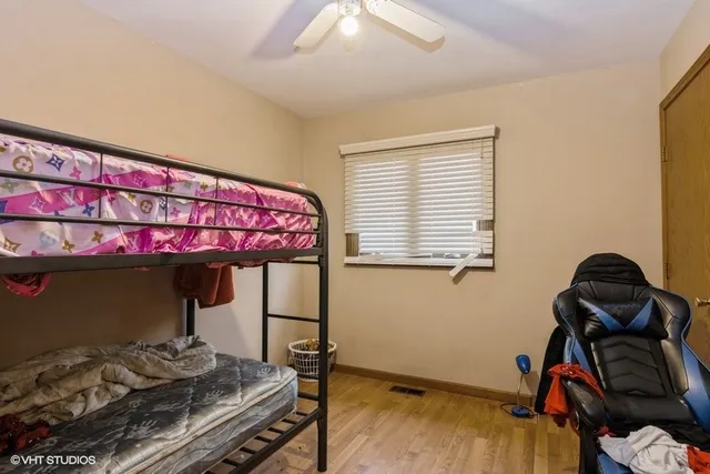 a room with a bed and a mirror