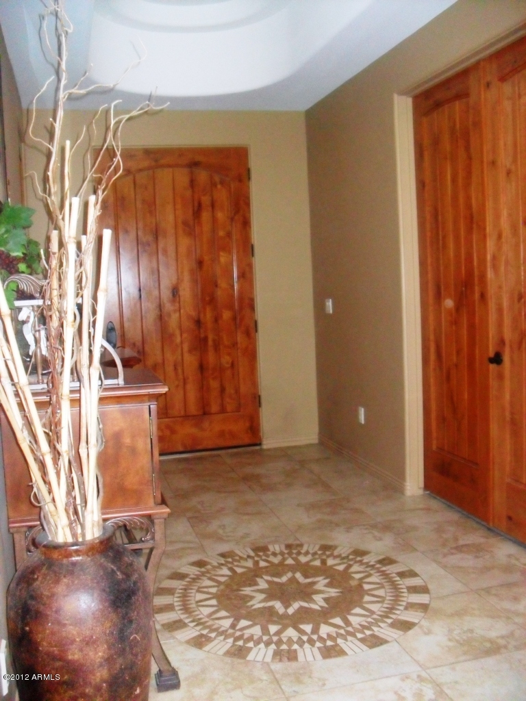 3020 East Ryan Road Gilbert, AZ 85297 - Photo 4 of 69 foyer view of front door solid knotty al