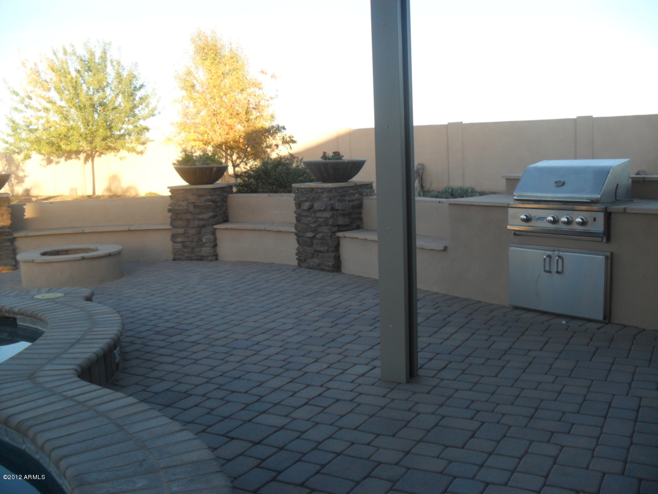3020 East Ryan Road Gilbert, AZ 85297 - Photo 57 of 69 custom firepit with lots of built in sit