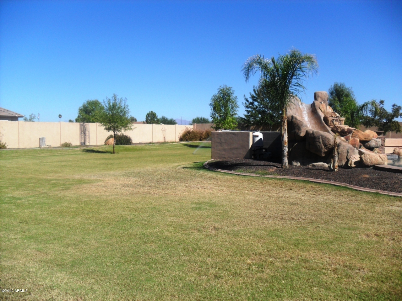 3020 East Ryan Road Gilbert, AZ 85297 - Photo 58 of 69 Large fenced irrigated yard with sprinkl