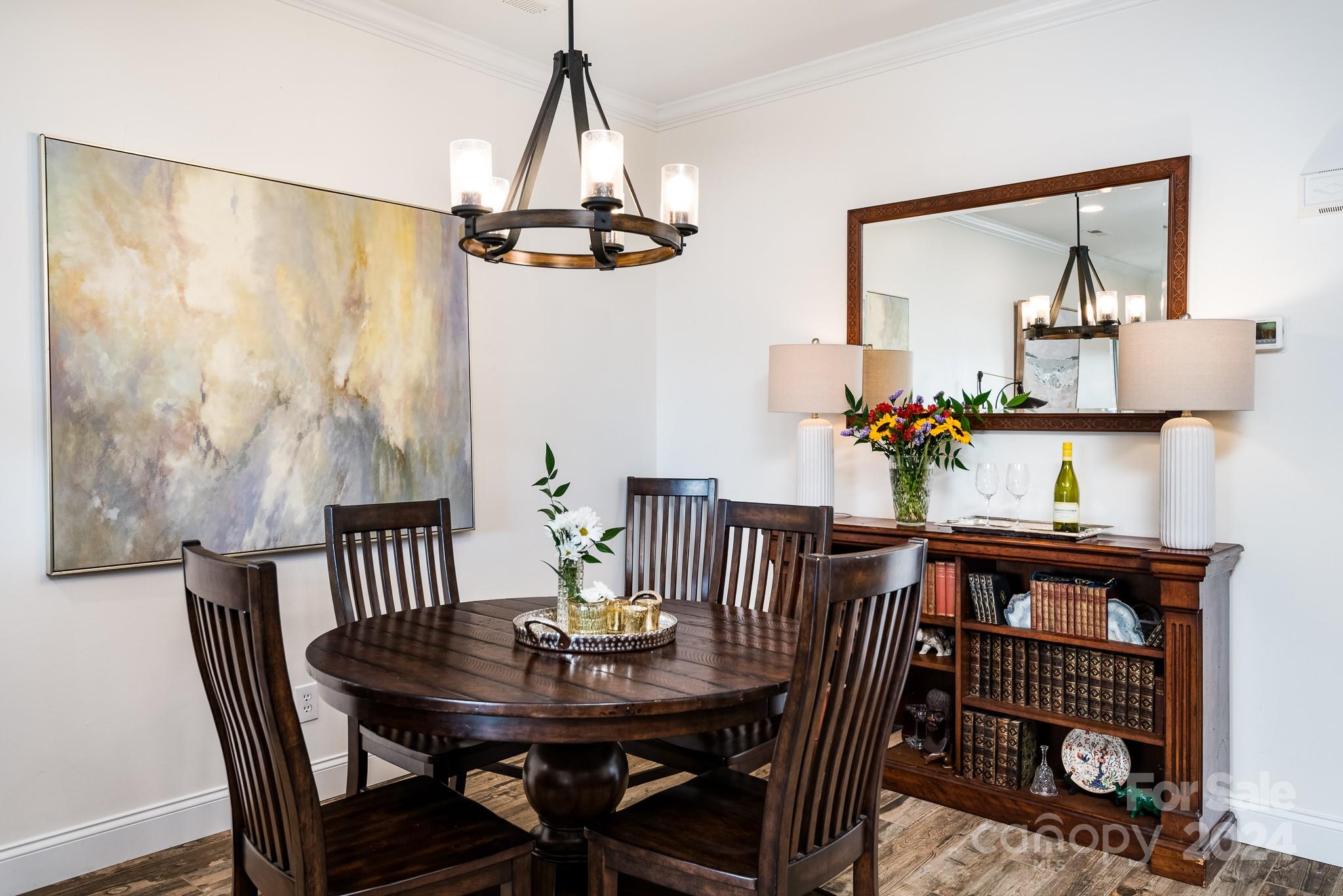 860 Jetton Street, Unit 64 Davidson, NC 28036 - Photo 11 of 33 a view of a dining room with furniture and wooden floor