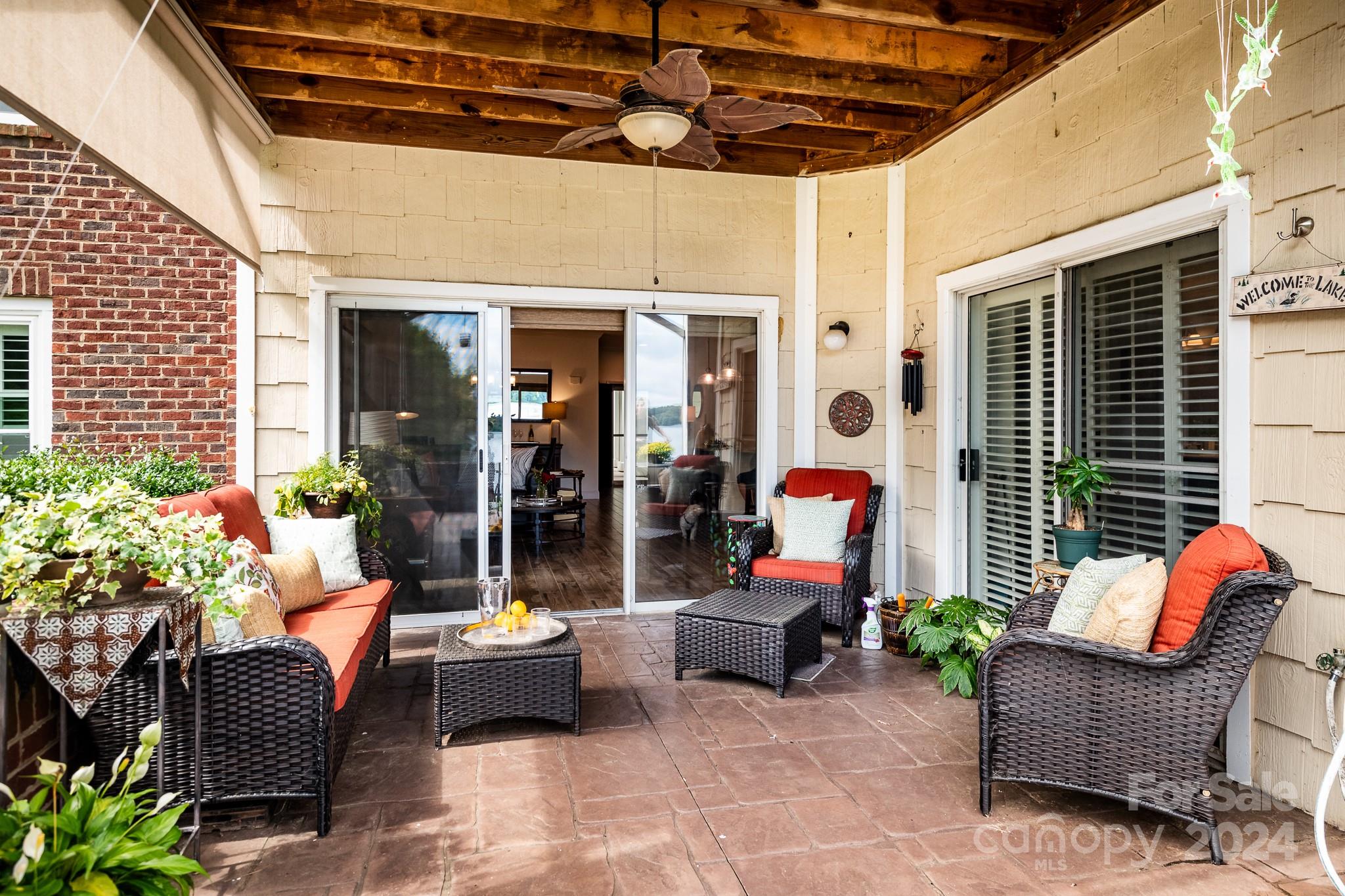 860 Jetton Street, Unit 64 Davidson, NC 28036 - Photo 14 of 33 a view of living room with patio furniture and potted plants