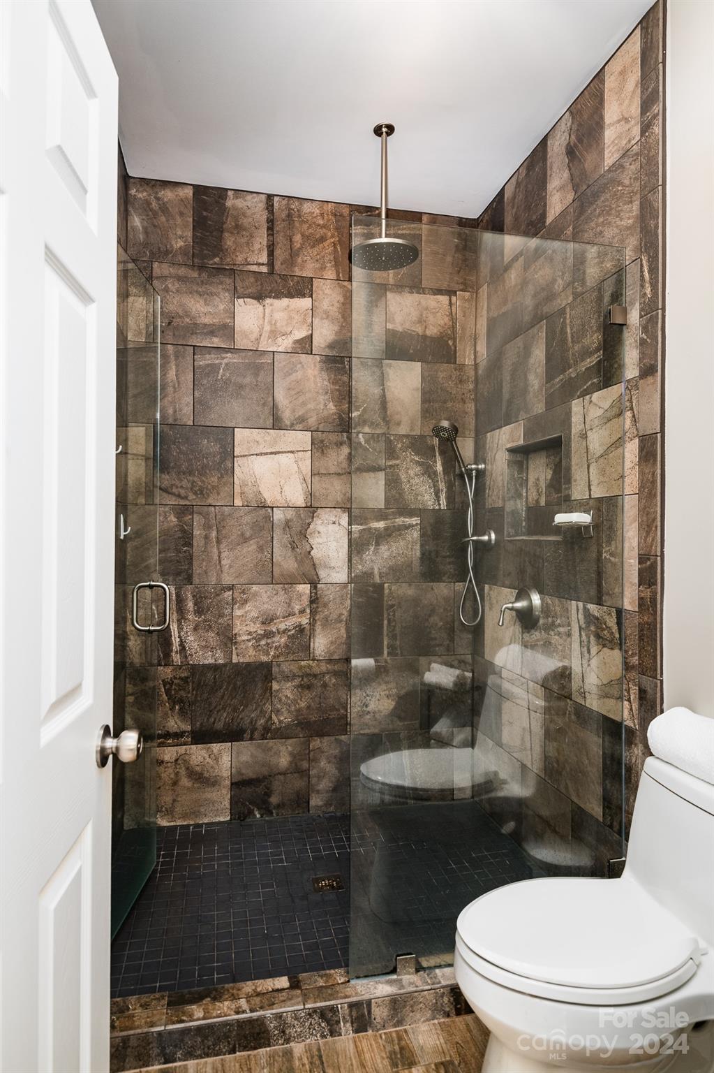 860 Jetton Street, Unit 64 Davidson, NC 28036 - Photo 20 of 33 a bathroom with a toilet and a shower