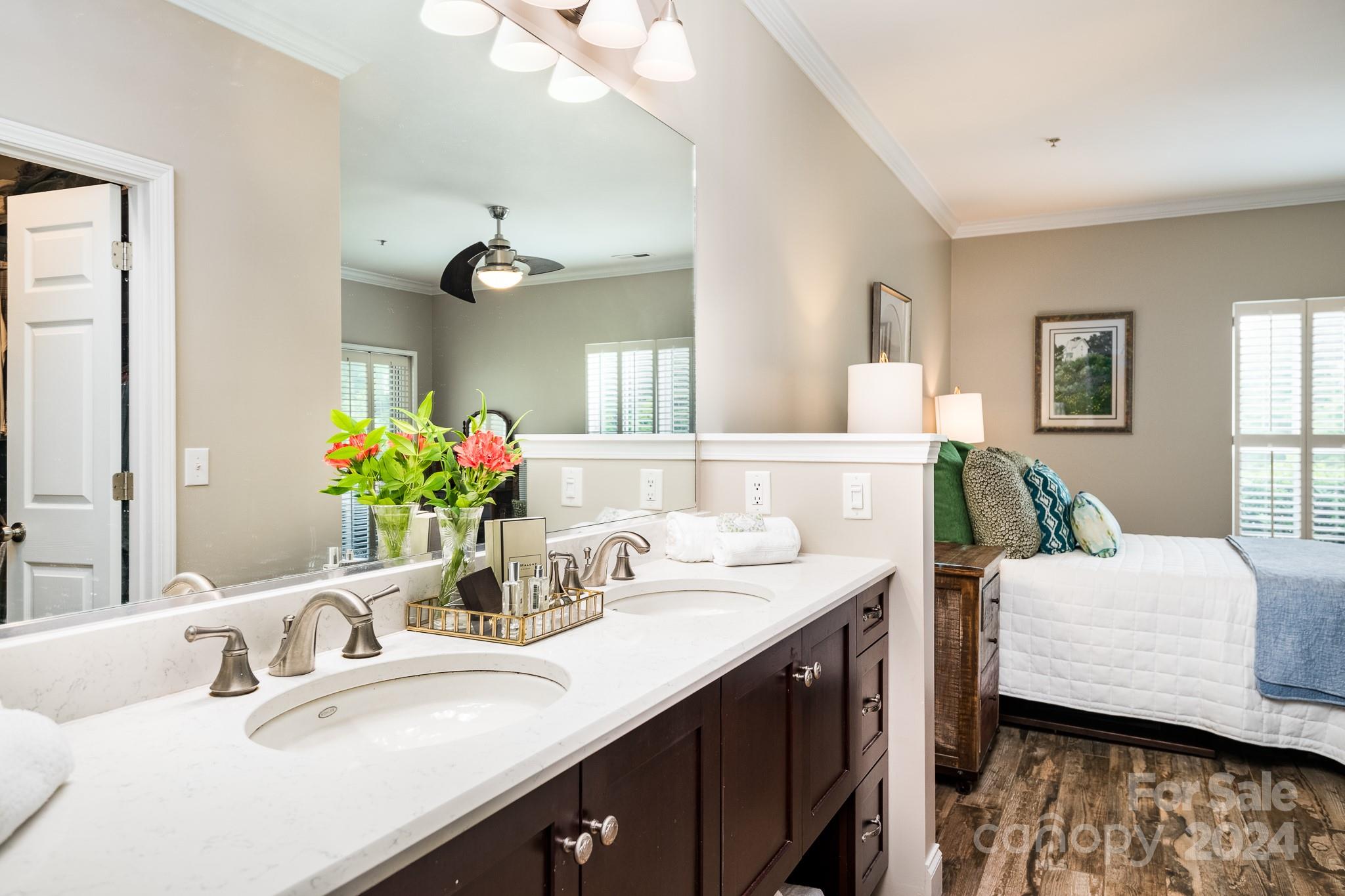 860 Jetton Street, Unit 64 Davidson, NC 28036 - Photo 21 of 33 a bathroom with a sink double vanity and a mirror