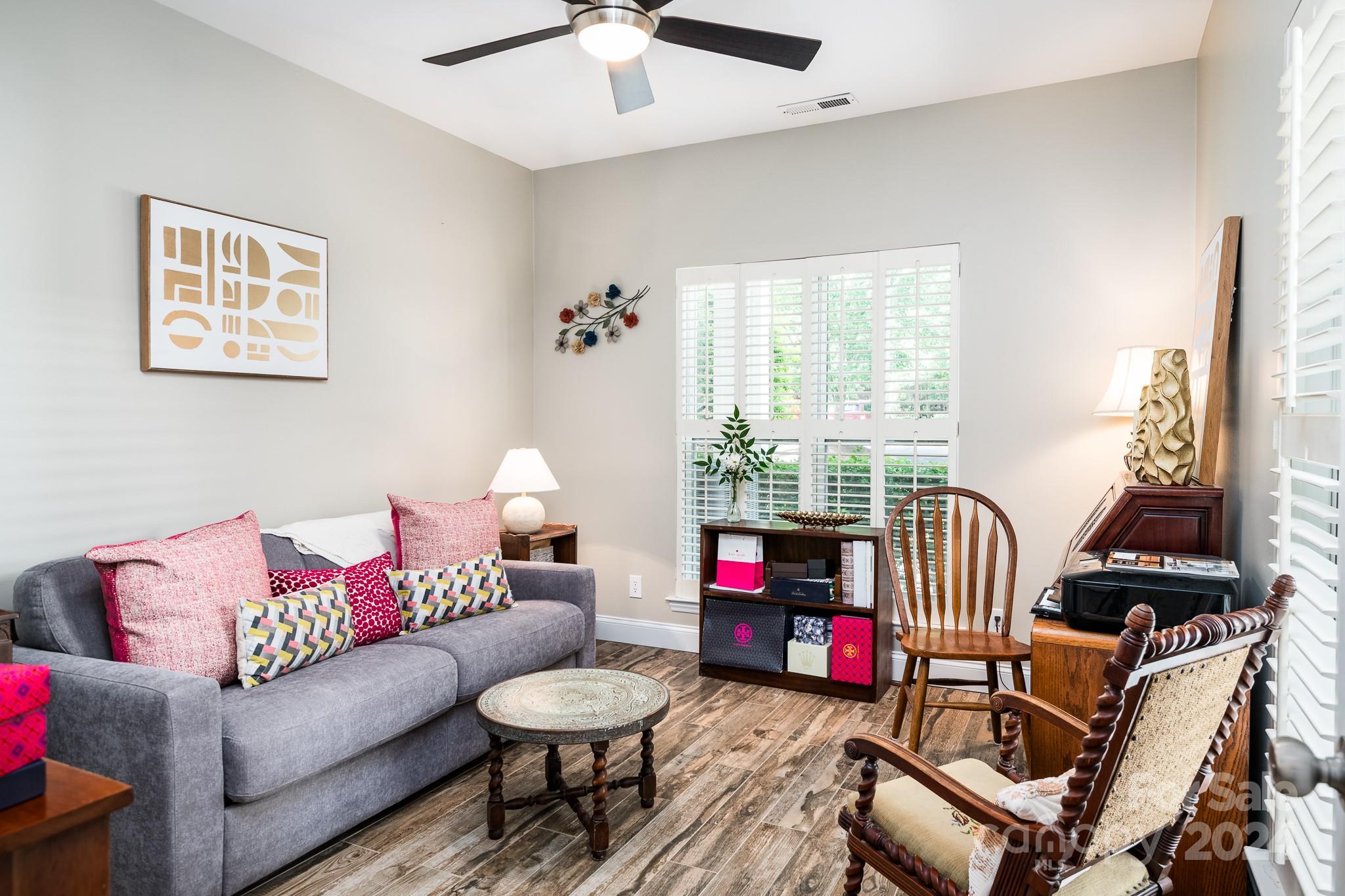 860 Jetton Street, Unit 64 Davidson, NC 28036 - Photo 24 of 33 a living room with furniture and a large window