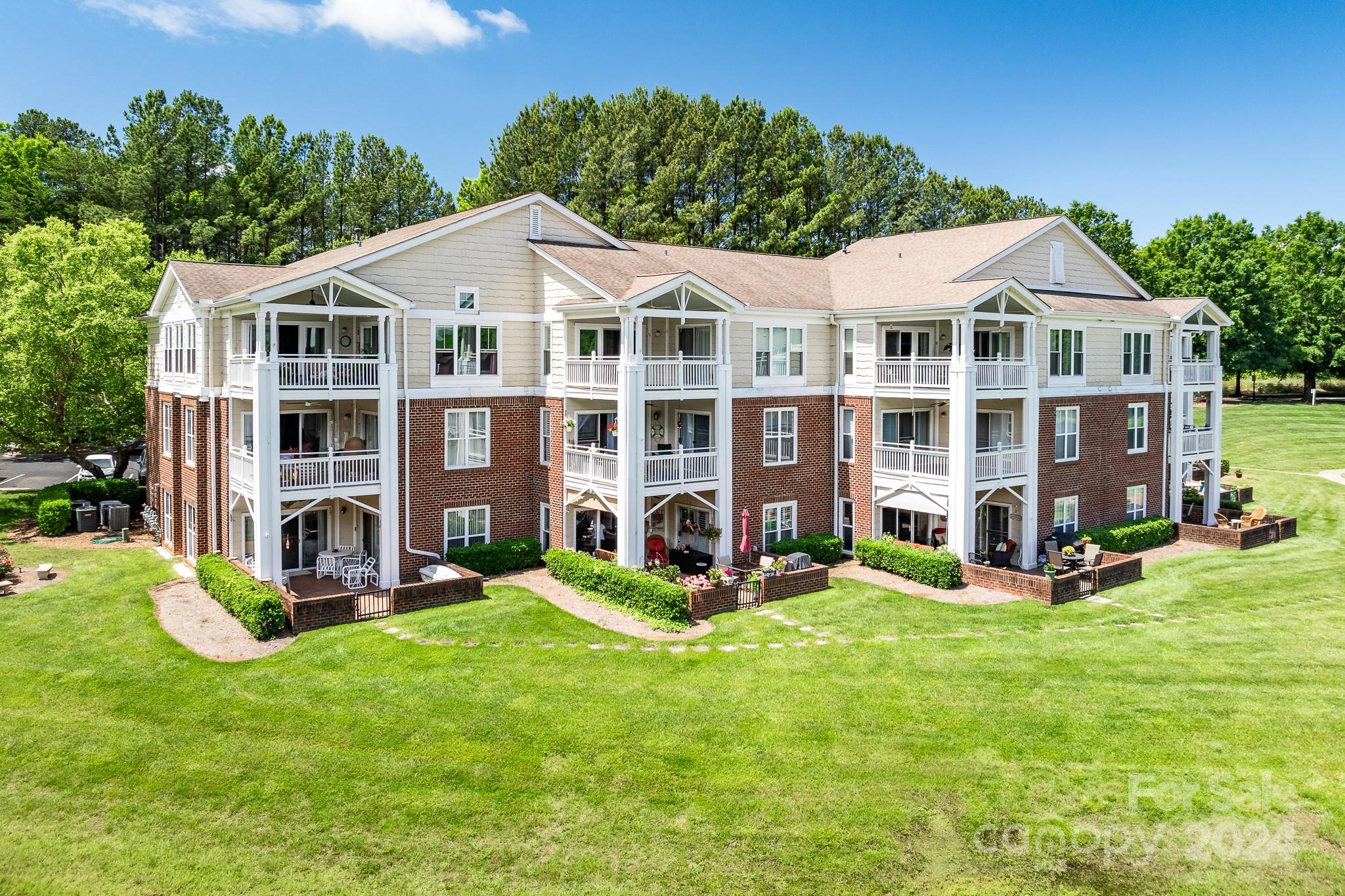 860 Jetton Street, Unit 64 Davidson, NC 28036 - Photo 26 of 33 a view of a yard in front of house