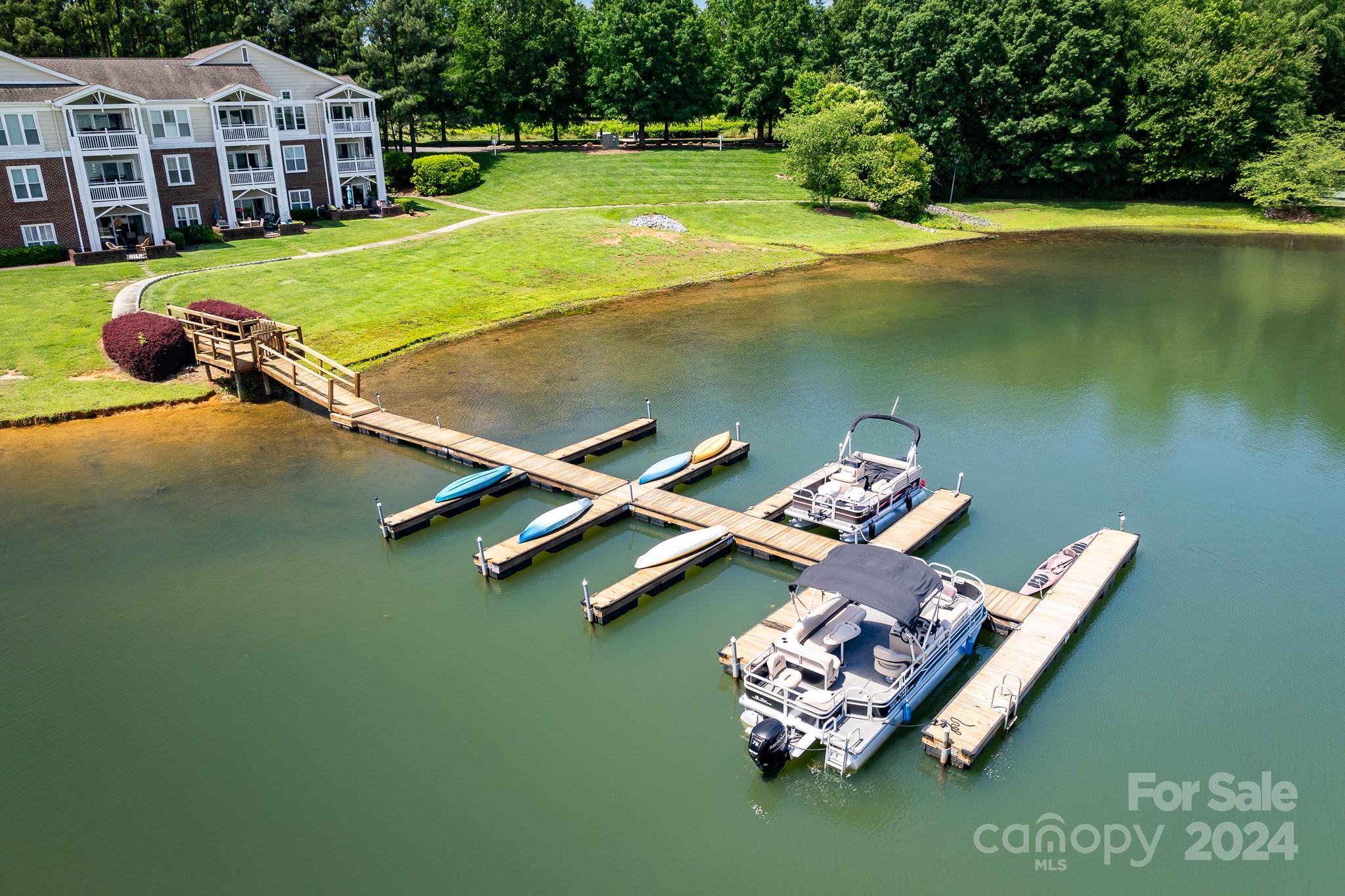 860 Jetton Street, Unit 64 Davidson, NC 28036 - Photo 27 of 33 a view of a house with a yard