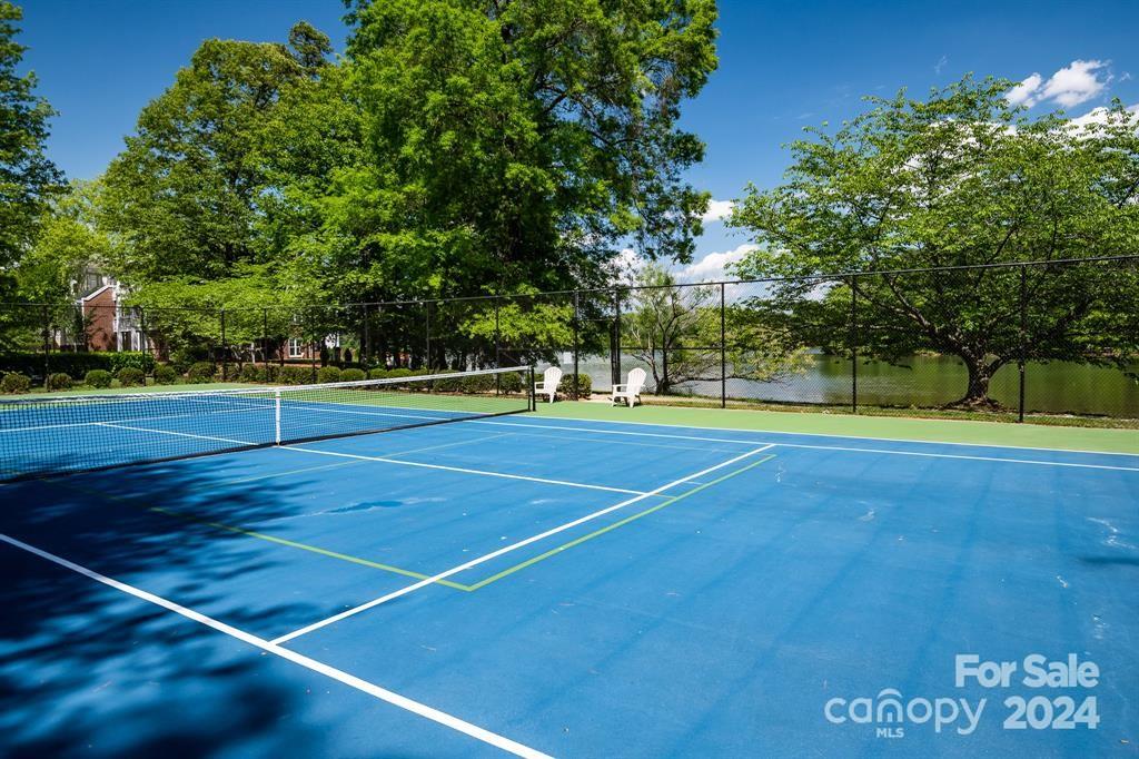 860 Jetton Street, Unit 64 Davidson, NC 28036 - Photo 31 of 33 a view of an outdoor space and tennis court