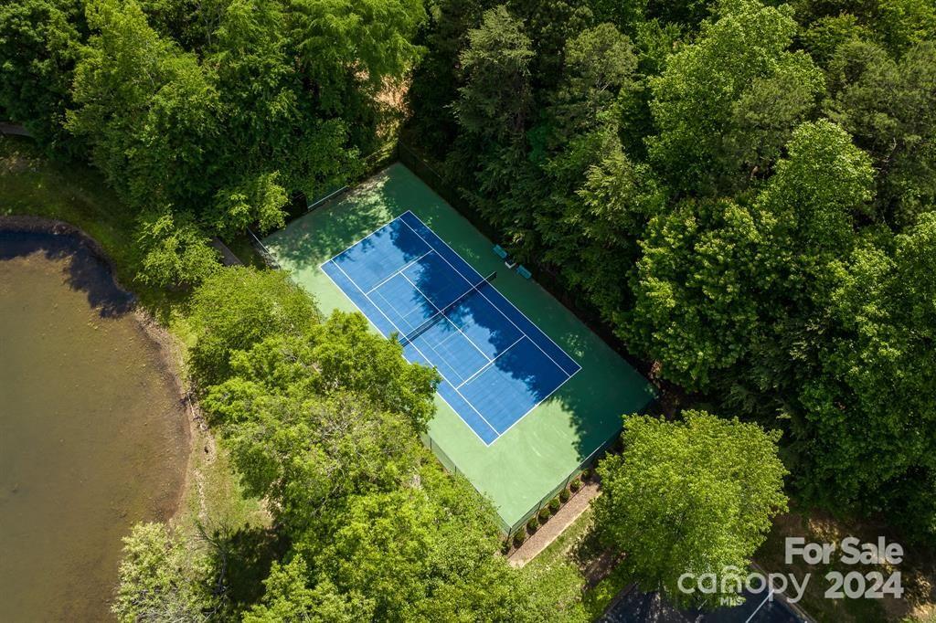 860 Jetton Street, Unit 64 Davidson, NC 28036 - Photo 32 of 33 a view of a house with a yard