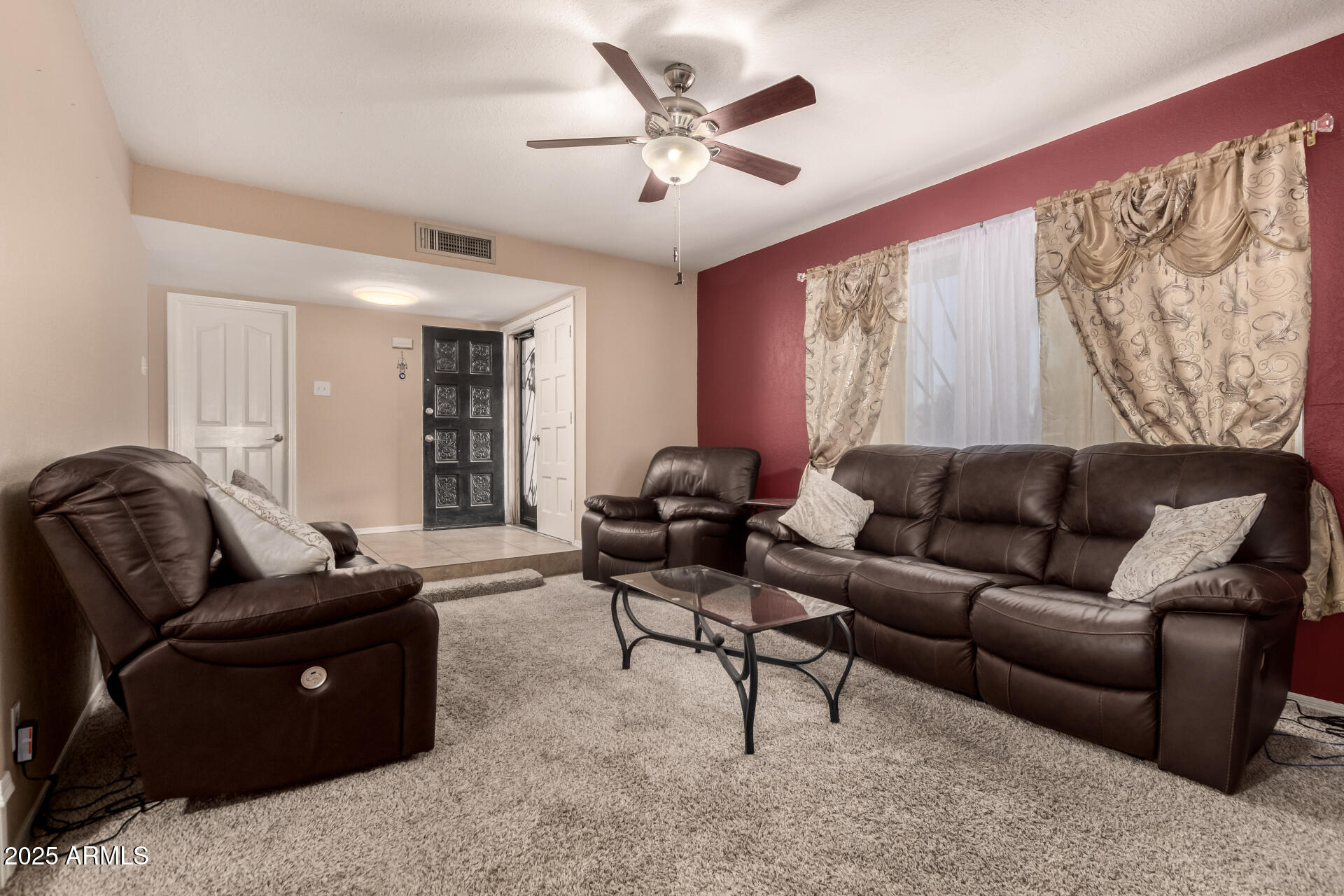 3529 West St Moritz Lane Phoenix, AZ 85053 - Photo 12 of 34 a living room with furniture and a large window