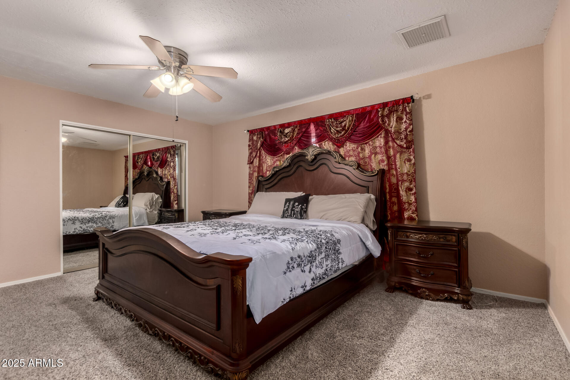 3529 West St Moritz Lane Phoenix, AZ 85053 - Photo 20 of 34 a bedroom with a bed and lamp with window