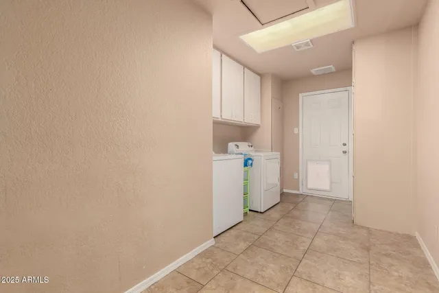 a view of storage and utility room with washer and dryer