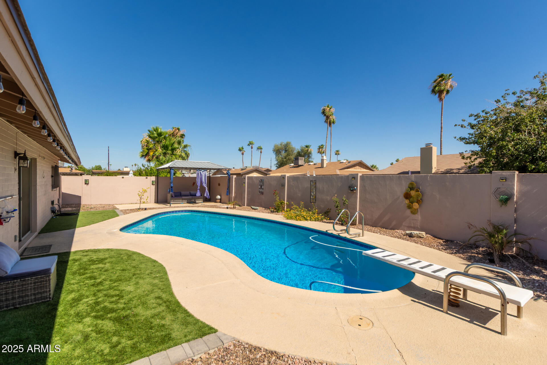 3529 West St Moritz Lane Phoenix, AZ 85053 - Photo 29 of 34 a view of a swimming pool with a patio