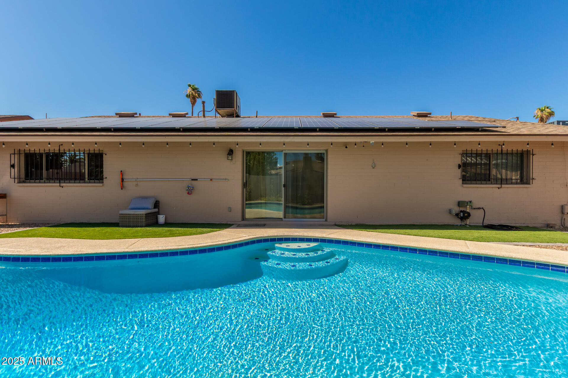 3529 West St Moritz Lane Phoenix, AZ 85053 - Photo 31 of 34 a swimming pool with outdoor seating and yard
