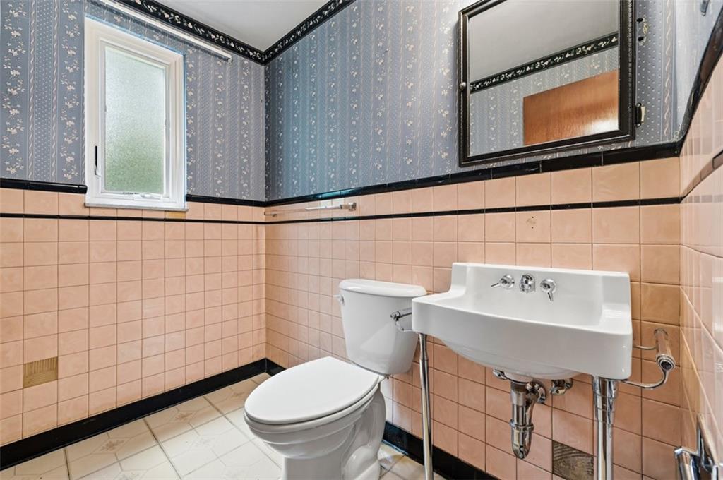 328 Ruthwood Avenue Pittsburgh, PA 15227 - Photo 20 of 32 a bathroom with a sink toilet and mirror