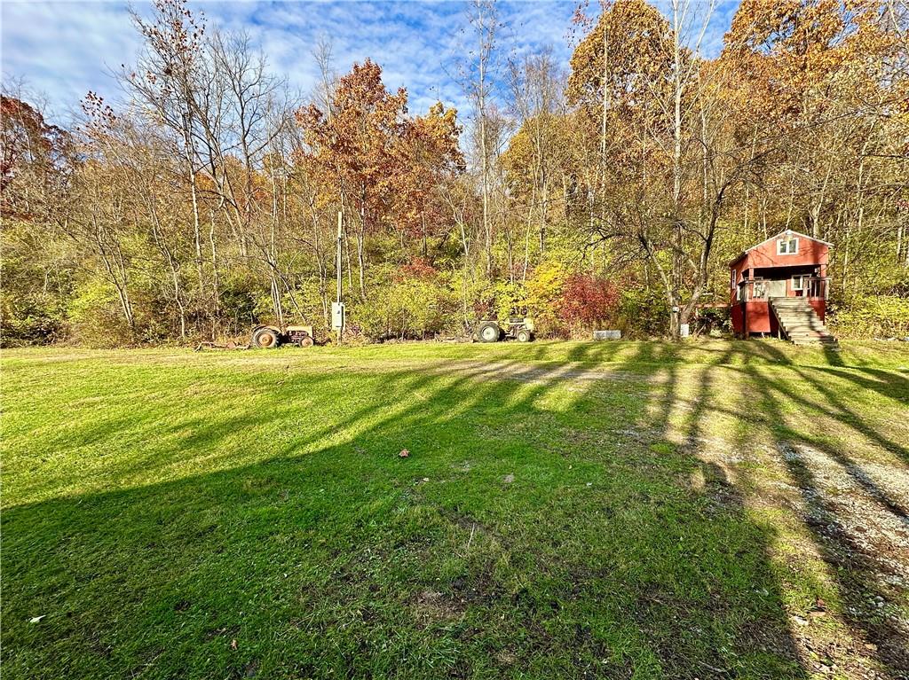 100-300 Tony Ditko Road Wampum, PA 16157 - Photo 11 of 16 a view of a golf ground with large trees