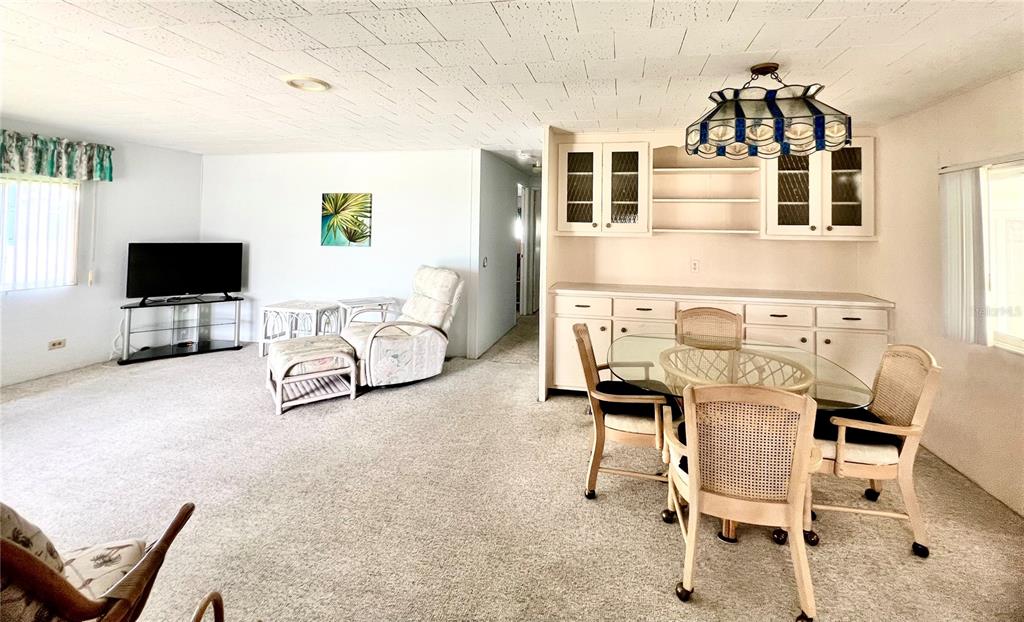 1100 South Belcher Road, Unit 64 Largo, FL 33771 - Photo 11 of 52 a view of a livingroom with furniture and a flat screen tv