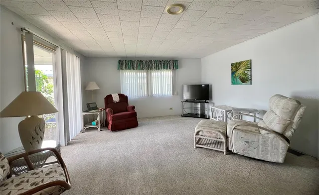 a kitchen with a refrigerator sink and cabinets