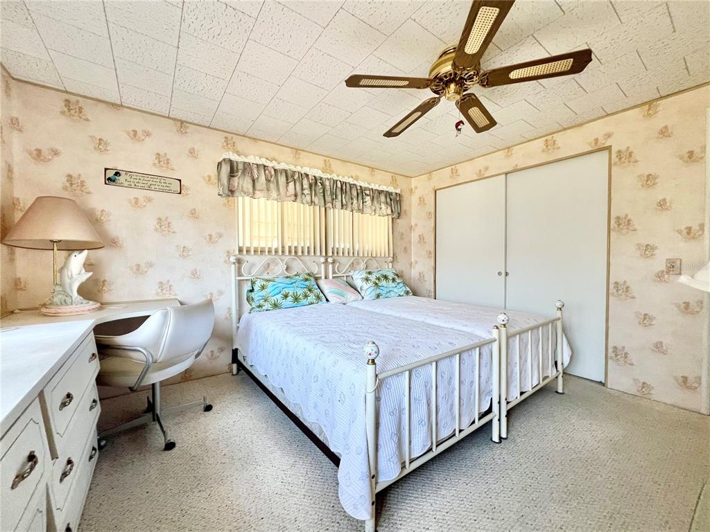 1100 South Belcher Road, Unit 64 Largo, FL 33771 - Photo 18 of 52 a bed room with a bed and a chair